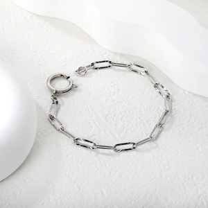 Elegant silver textured paperclip chain bracelet with a large circular spring clasp
