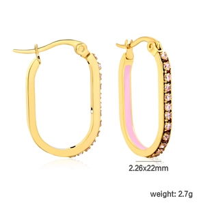 Detailed view of oval gold earrings with pink enamel inlay and sparkling zircon stones