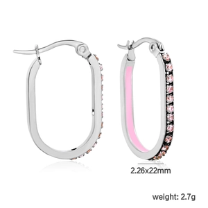 Detail view of oval silver earrings with pink zircon inlay and enamel finish