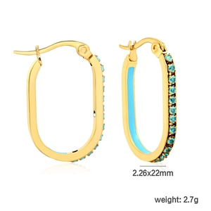Detail view of oval gold hoop earrings with sky blue stones and enamel inlay, 22mm size