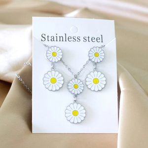 Daisy pendant necklace set in stainless steel with five white and yellow floral charms