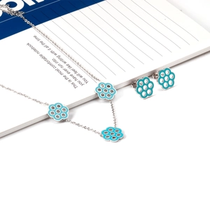 Stainless steel jewelry set featuring teal enamel flower necklace and matching stud earrings