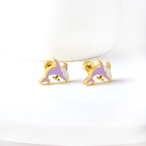 Golden dolphin stud earrings with purple enamel detail on a minimalist white display