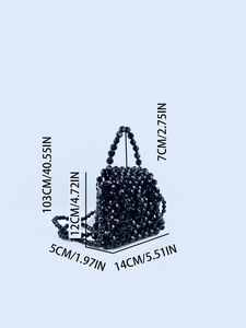 Detailed view of black beaded handbag dimensions with strap and handle measurements