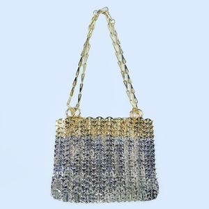 Detailed view of handmade metal paillette chain bag with gold and silver gradient finish