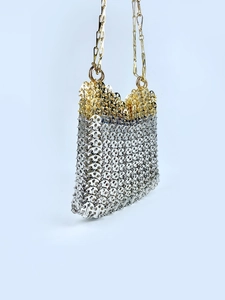 Macro detail of handmade gold and silver metallic sequins on this elegant evening bag