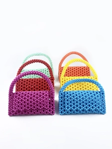 Selection of handmade colorful beaded handbags in vibrant candy colors for summer style