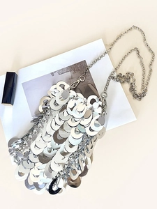 Silver sequin crossbody bag with chain strap and shiny metallic finish for evening wear
