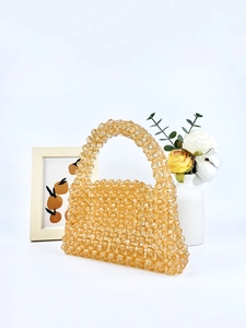 Sac à main artisanal en perles acryliques ambrées pour femme au design tissé