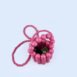 Pink handmade pearl beaded bucket bag with shoulder strap and mini lipstick storage