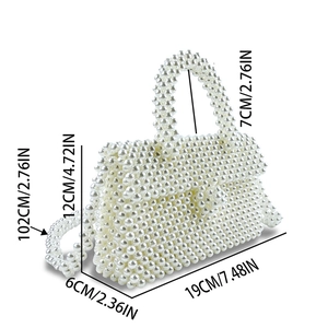 Detailed size chart for the handmade beaded handbag featuring white pearl woven texture