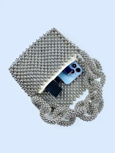 Luxurious silver beaded handmade handbag with metal luster handle and zipper closure