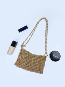Sparkling gold metal sequin woven crossbody bag with elegant chain strap and accessories