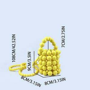Detailed view of yellow beaded mini bucket bag with dimensions of handle and strap