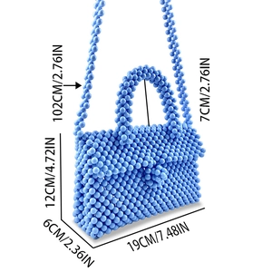 Detailed view of blue beaded handbag with size specs showing height and strap length