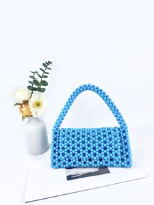 Sky blue handmade beaded handbag with creative hollow design and woven top handle