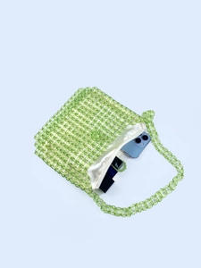 Handmade clear green acrylic beaded shoulder bag with satin liner and daily essentials