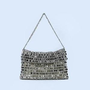Detail of silver metallic sequin shoulder bag with woven fish scale texture and chain