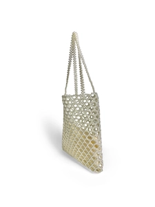 Detail view of handmade white pearl beaded tote bag with woven mesh and inner pouch