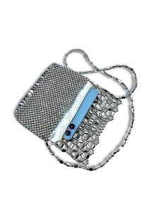 Silver metallic hollow bead hand-woven shoulder bag with a white satin zip pouch inside