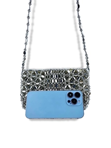 Handmade silver metallic beaded crossbody bag shown with smartphone for size comparison