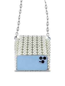 Mini handmade white pearl beaded shoulder bag with crossbody strap and smartphone inside