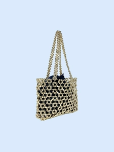 Metallic hollow beaded tote bag in gold with contrasting blue drawstring lining pouch
