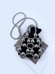 Metallic silver beaded handbag with black velvet drawstring pouch and chain strap
