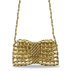 Detail of golden woven metal mesh bag with bow shape and bamboo style link chain