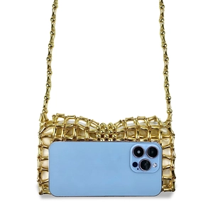 Detailed view of mini gold woven bag with satin lining and size comparison to a smartphone