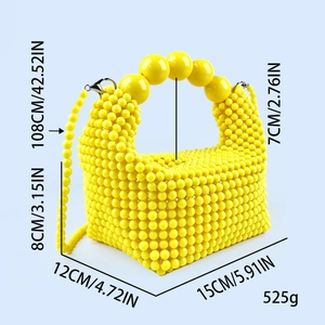 Front 45-degree angle of yellow handmade beaded handbag with dimensions and weight data