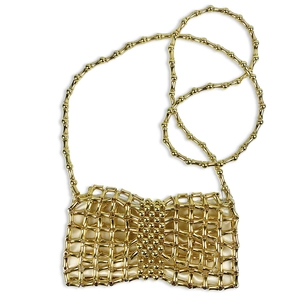 Detail view of mini gold beaded bag with bamboo-style weave and silk lining