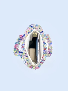 Top view of handmade rainbow beaded handbag showing spacious interior and colorful beads