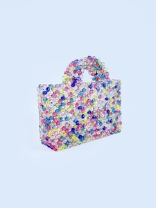 Handmade colorful beaded handbag for women featuring vibrant rainbow beads and top handle