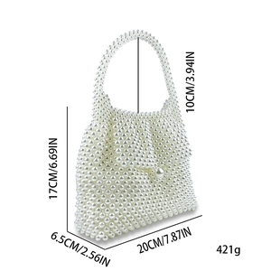 Detail of white pearl woven handbag showing 17x20cm dimensions and luxury texture