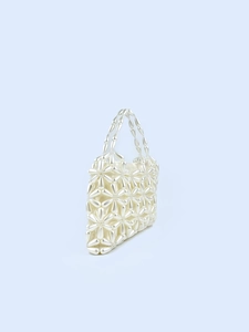 Elegant white pearl beaded handbag with floral pattern and top handles for weddings
