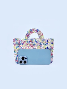 Handmade colorful beaded mini handbag with blue smartphone for size comparison