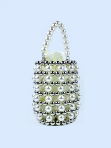 Elegant beaded bucket bag with white pearls and silver beads over a satin drawstring pouch