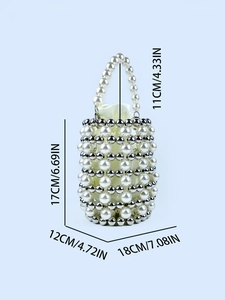 Handmade bucket bag with white pearls and silver beads featuring a satin drawstring pouch