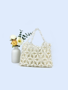 Elegant white pearl beaded handbag with floral pattern and satin lining for parties