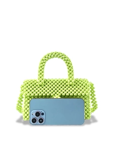 Handmade lime green beaded handbag with smartphone for size and capacity reference