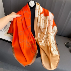 Silky 110x110cm square scarf with orange floral prints and elegant brown edges