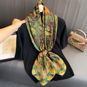 Artistic printed silk scarf with vintage green and yellow patterns for beach sunscreen