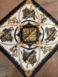 Detail of vintage equestrian chain print on luxury square satin scarf with baroque patterns