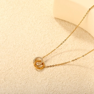 18K gold plated necklace with interlocking double circles and pavé crystal pendants