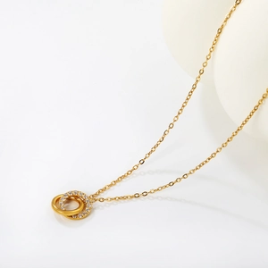 Polished 18K gold-plated stainless steel necklace with interlocking CZ double circle pendant