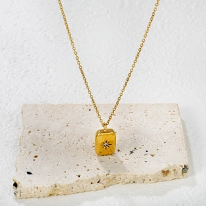 18K gold plated stainless steel necklace with a star-etched gold bar pendant and zircon