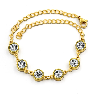 Detailed shot of a gold-plated bracelet featuring five round-cut sparkling cubic zirconia crystals