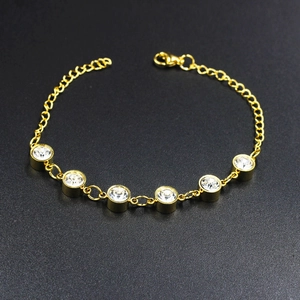 Gold plated stainless steel bracelet with white crystals and faux pearl accents