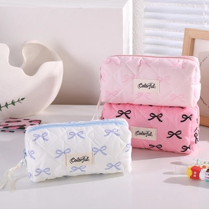 Quilted bow pencil case and makeup bag set in soft pink and white tones